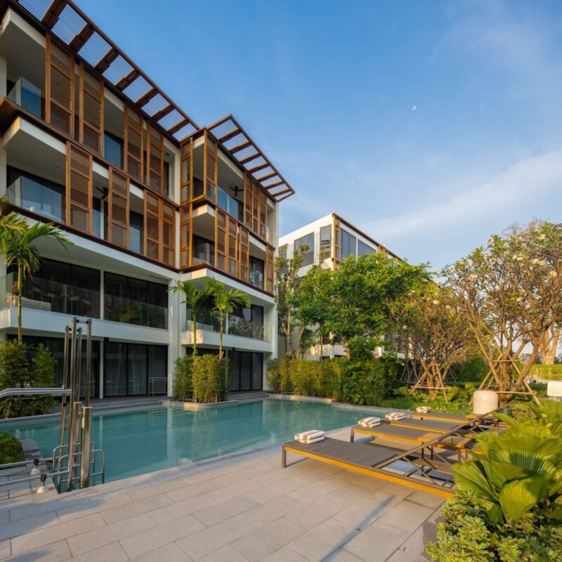 Pool garden with sun loungers at InterContinental Hua Hin
